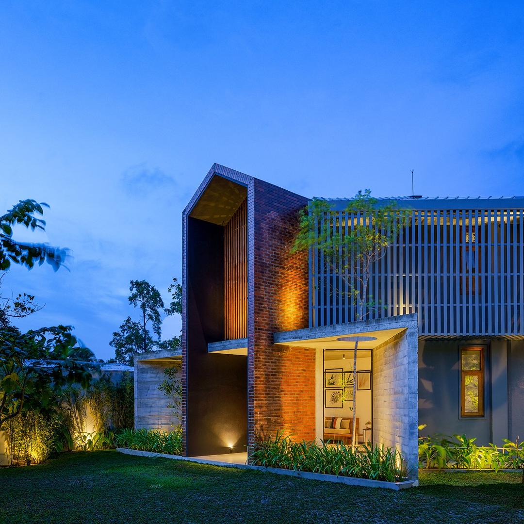 Bolgoda Lake Villa architectural exterior at dusk with tropical landscaping