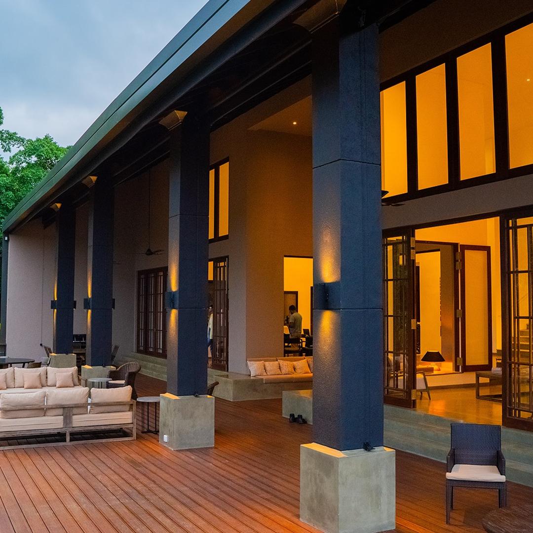 Lily Pod Bolgoda villa exterior with pool and warm facade lighting at evening
