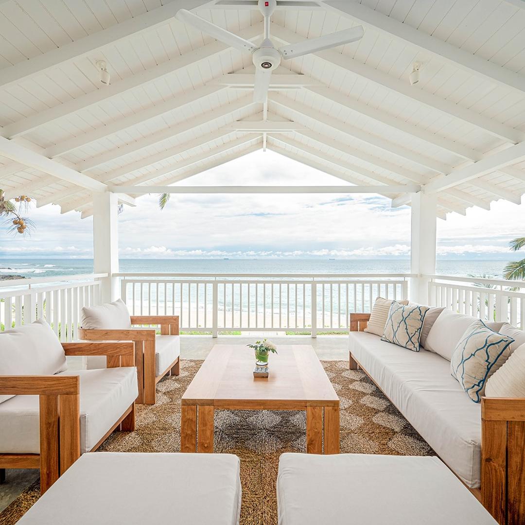 Mirissa luxury villa open pavilion with ocean view and white sofas
