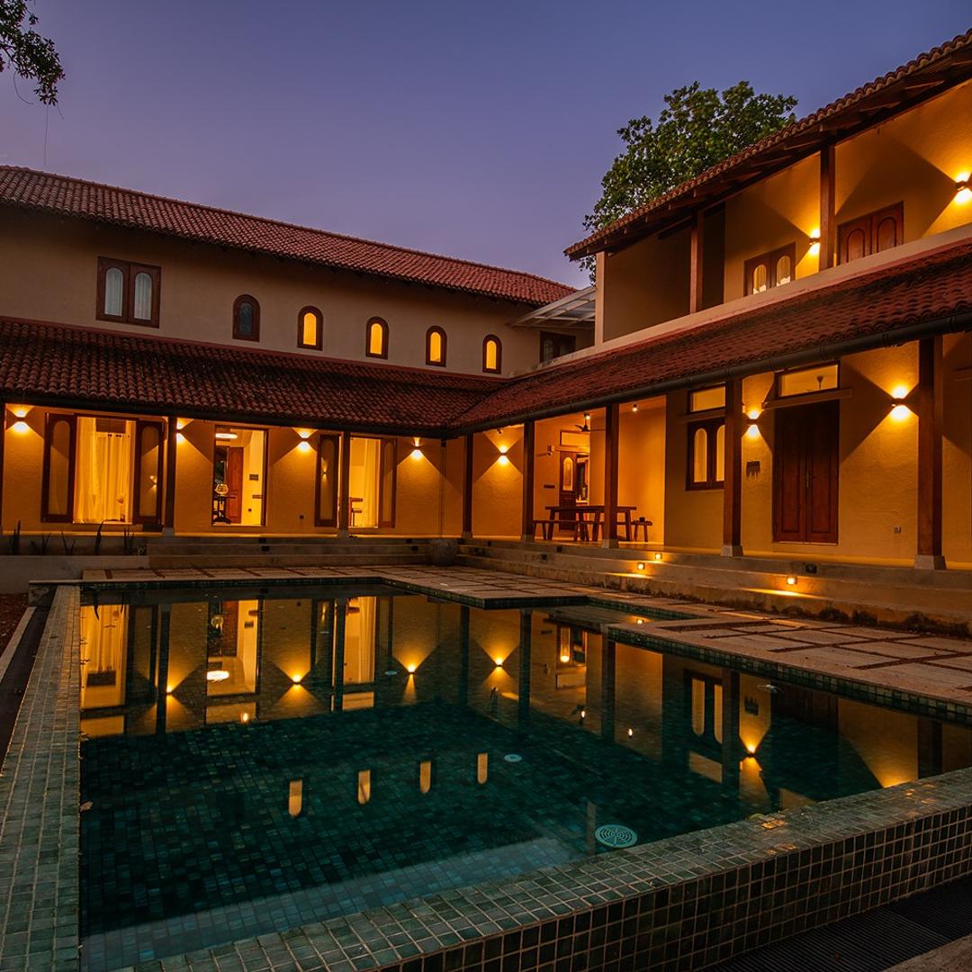 Origin Balapitiya villa and pool beautifully illuminated at evening