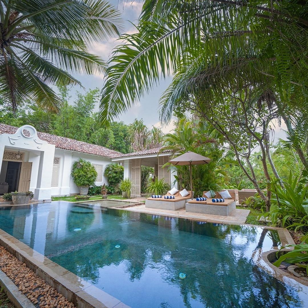 Rivers Edge pool and villa illuminated at evening
