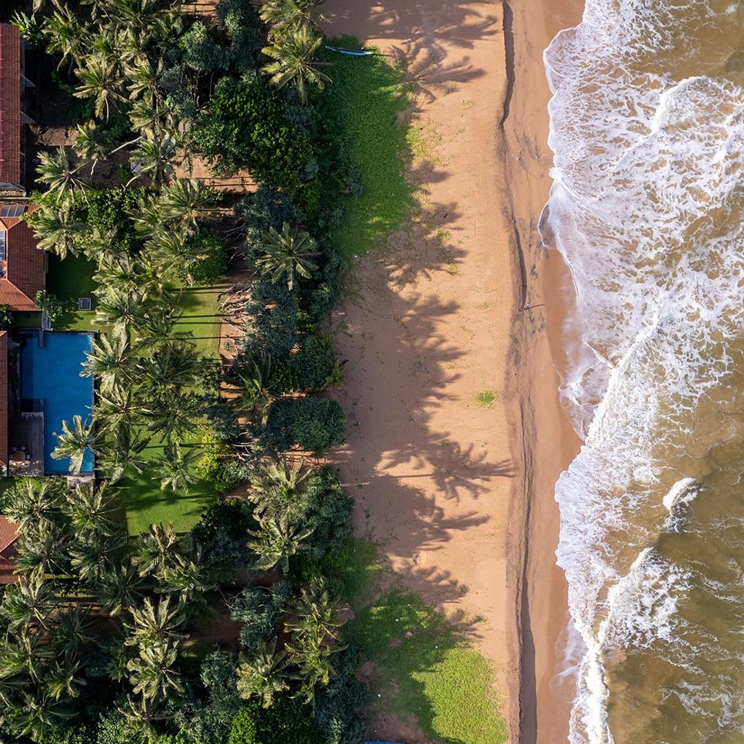 Kirana Villa Bentota aerial overhead view showing pool and Bentota beach, Sri Lanka