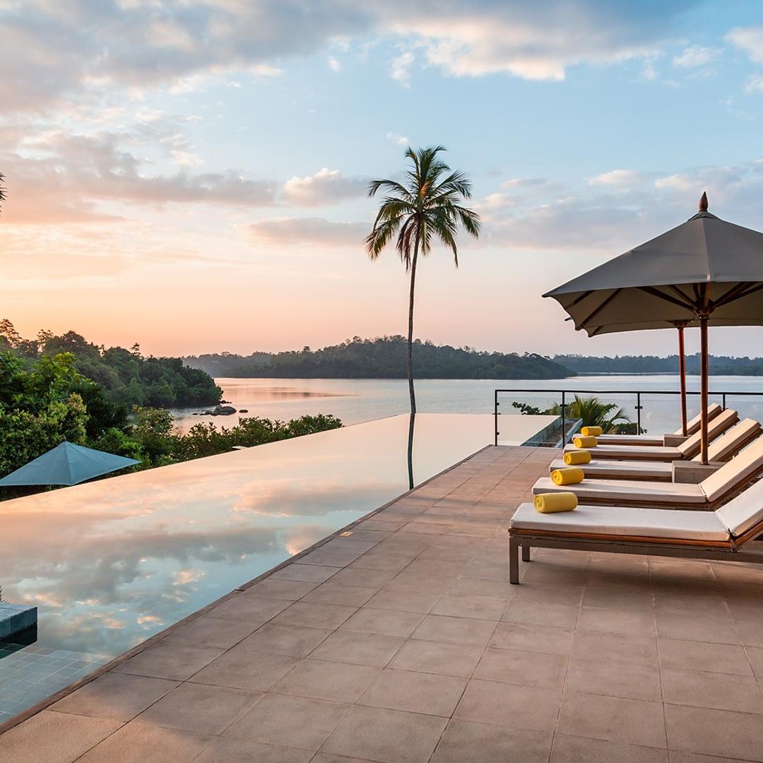 Tri Ahangama main pool with loungers at sunset