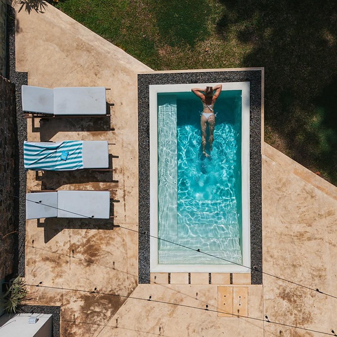 Kanda House Talpe aerial pool and lawn view