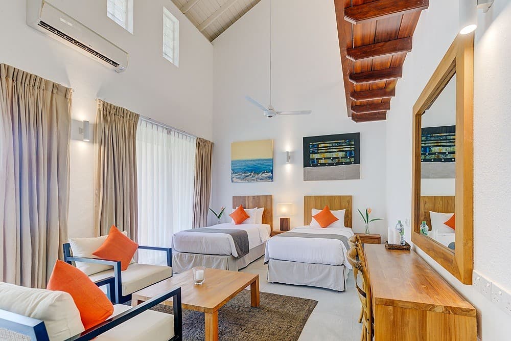 Beachfront villa master bedroom with king bed, ensuite bathroom and ocean views