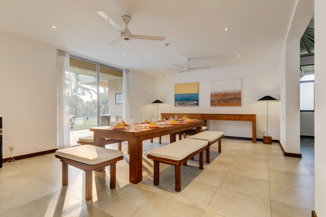 Open-air dining pavilion at a beachfront villa in Wadduwa with garden setting