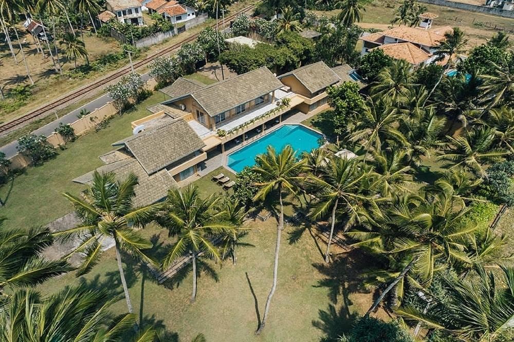 Aerial view of Wadduwa Beach Villa showing pool, garden and direct beach access