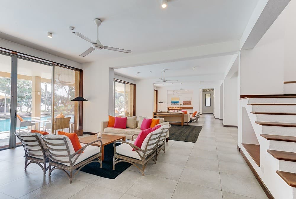 Villa indoor lobby and open-plan living area with high ceilings and natural light