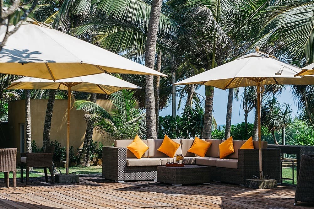 Wadduwa Beach Villa outdoor seating area with sun loungers beside the private pool