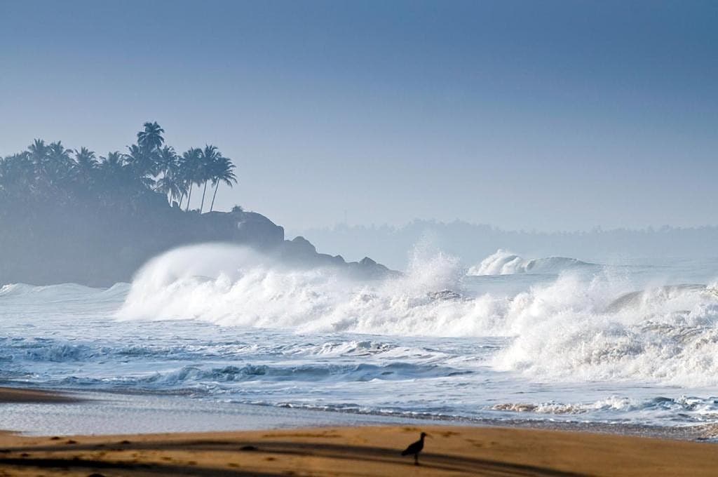 Sri Villas Induruwa beachfront with dramatic ocean waves and golden shore