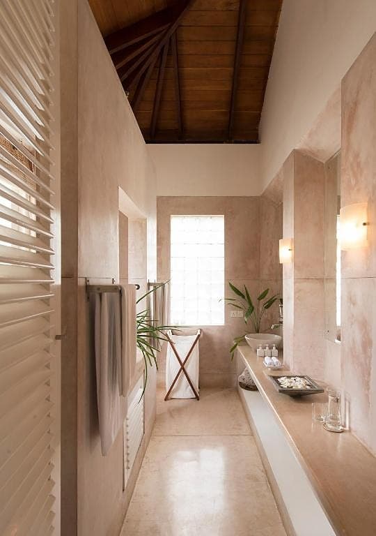 Minimalist villa corridor with warm pendant lighting in Induruwa Sri Lanka
