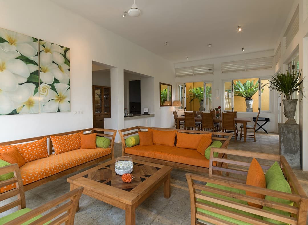 Araliya wing lounge area with colonial-style furniture and tropical garden views