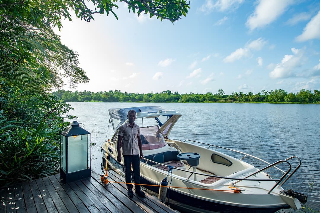 Villa boat captain preparing for departure from private lakeside jetty