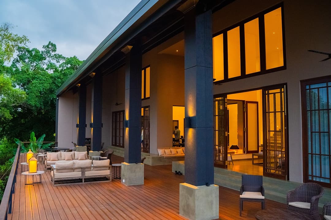 Lily Pod Bolgoda villa exterior with pool and warm facade lighting at evening