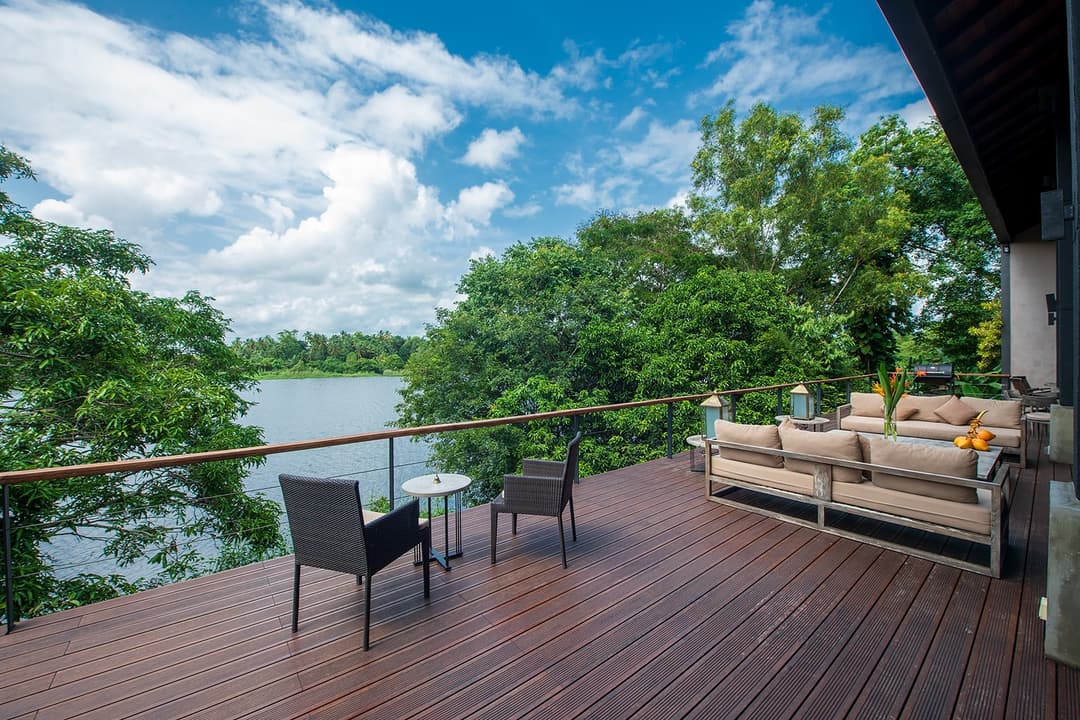 Celeste Bolgoda lakeside deck with outdoor lounge under open blue sky