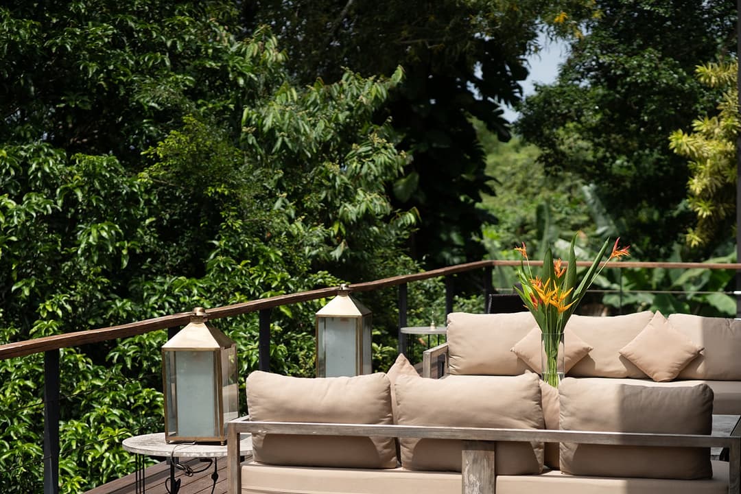 Celeste Bolgoda outdoor lounge with direct lake views and lush tropical garden
