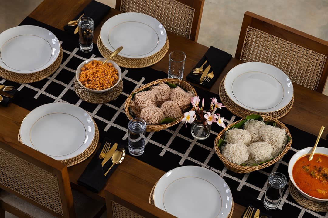 Overhead view of villa dining table with Sri Lankan rice and curry feast
