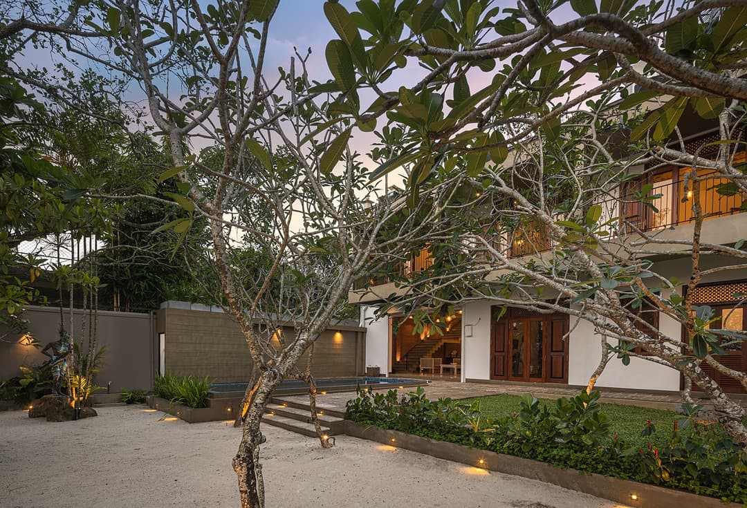 Villa garden with mature trees and courtyard entrance in Bentota Sri Lanka