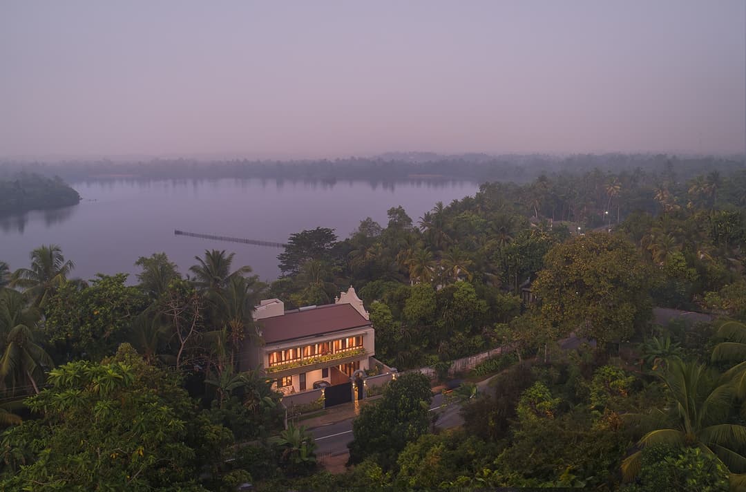 Aerial view of Yahva Bentota surrounded by forest on the shores of Dedduwa Lake
