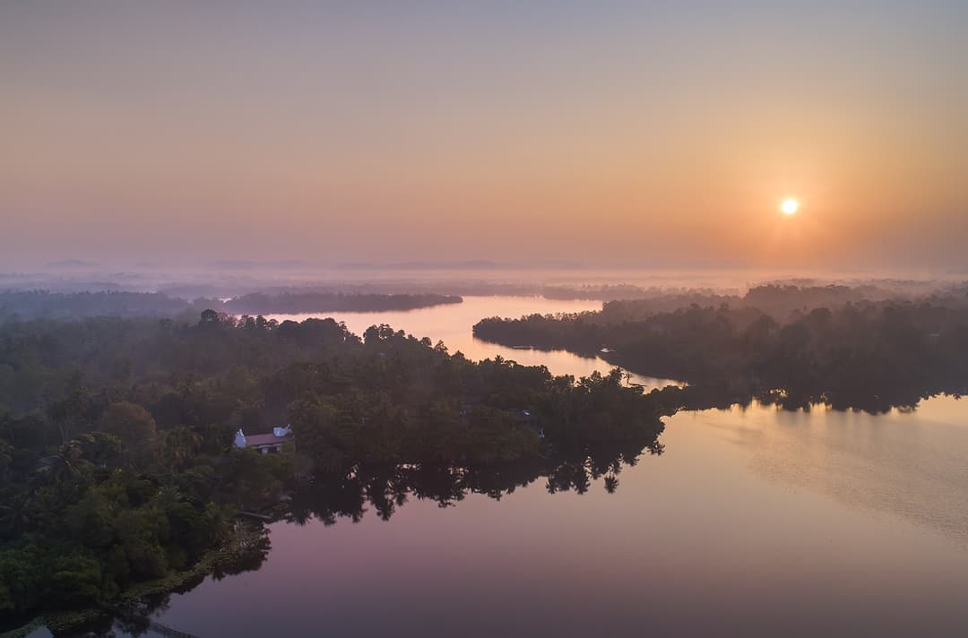 Aerial view of Dedduwa Lake at pink sunset from Yahva Bentota Sri Lanka
