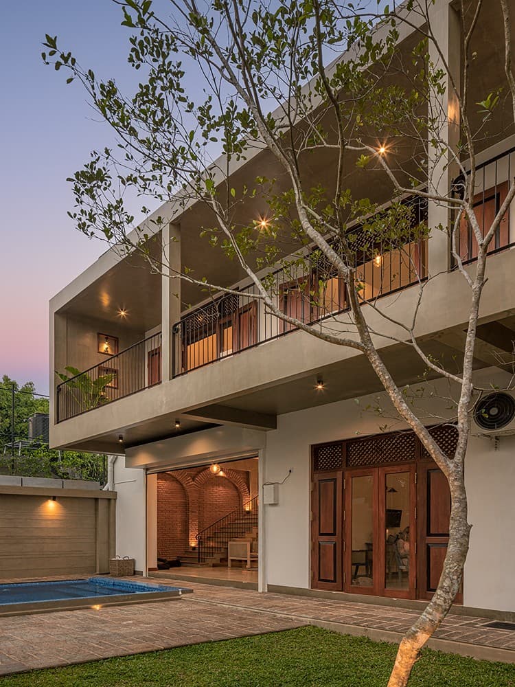 Yahva Bentota villa exterior with pool and lush tropical garden in the evening