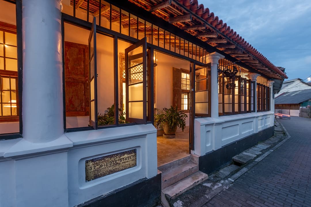 32 Middle Street Galle Fort exterior facade illuminated at evening on cobblestone street