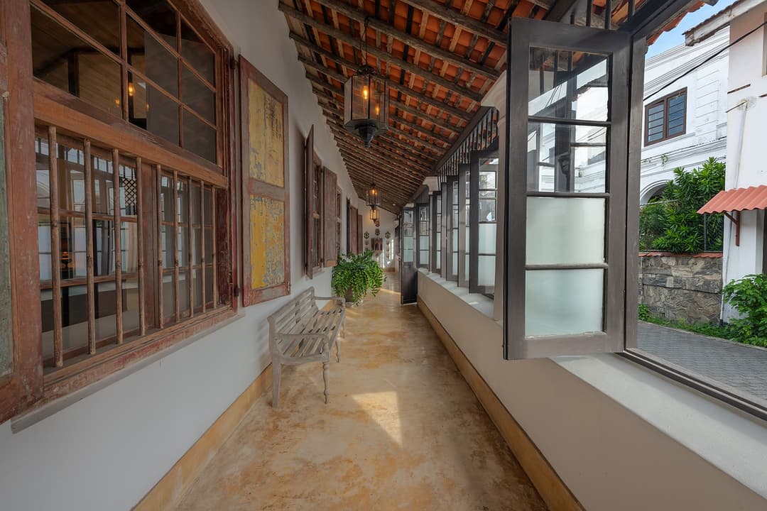 32 Middle Street Galle Fort gallery corridor with arched windows and patterned tiles