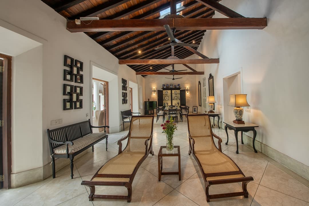 32 Middle Street Galle Fort open-plan living room with colonial timber ceiling and benches