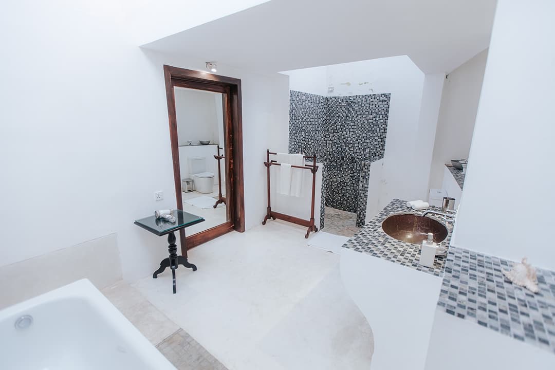 Villa ensuite with freestanding bathtub and mosaic tile detail inside Galle Fort