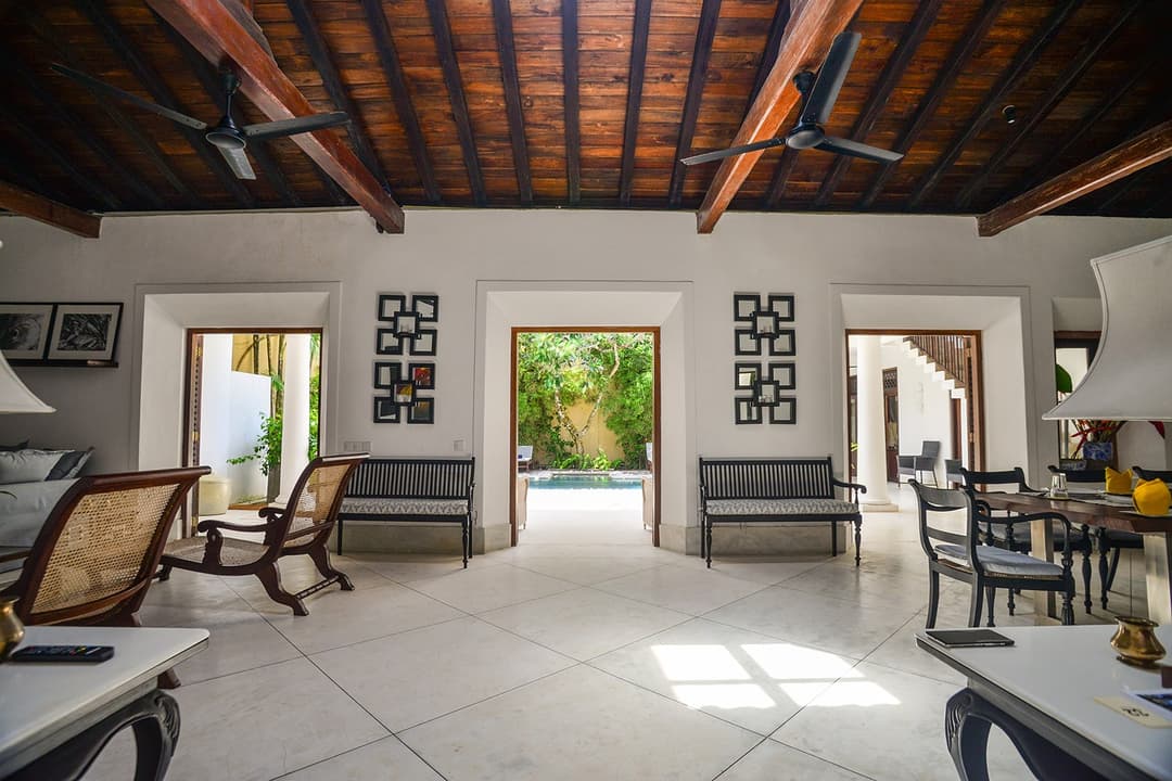 Wide-angle view of villa living room with timber ceiling and open plan layout Galle Fort