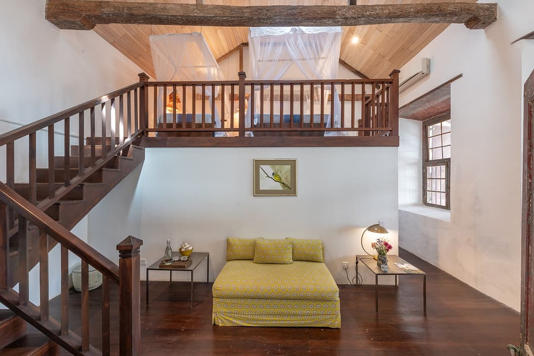 Villa mezzanine staircase and open living room inside a colonial Galle Fort villa