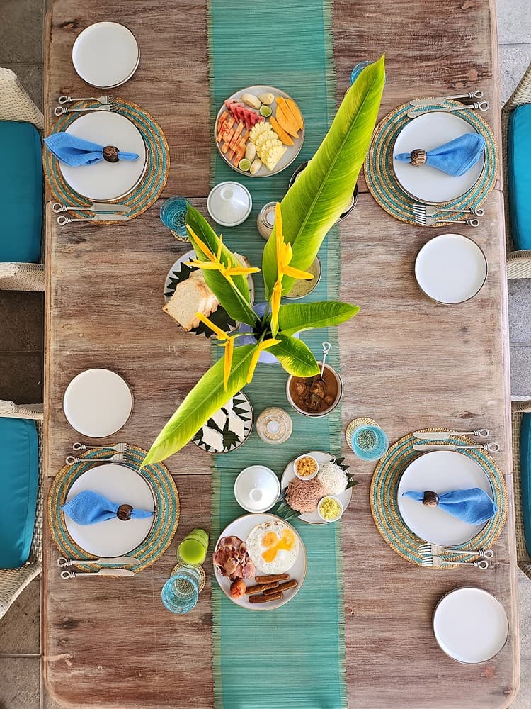 Overhead view of beachfront villa dining table with Sri Lankan curries Unawatuna