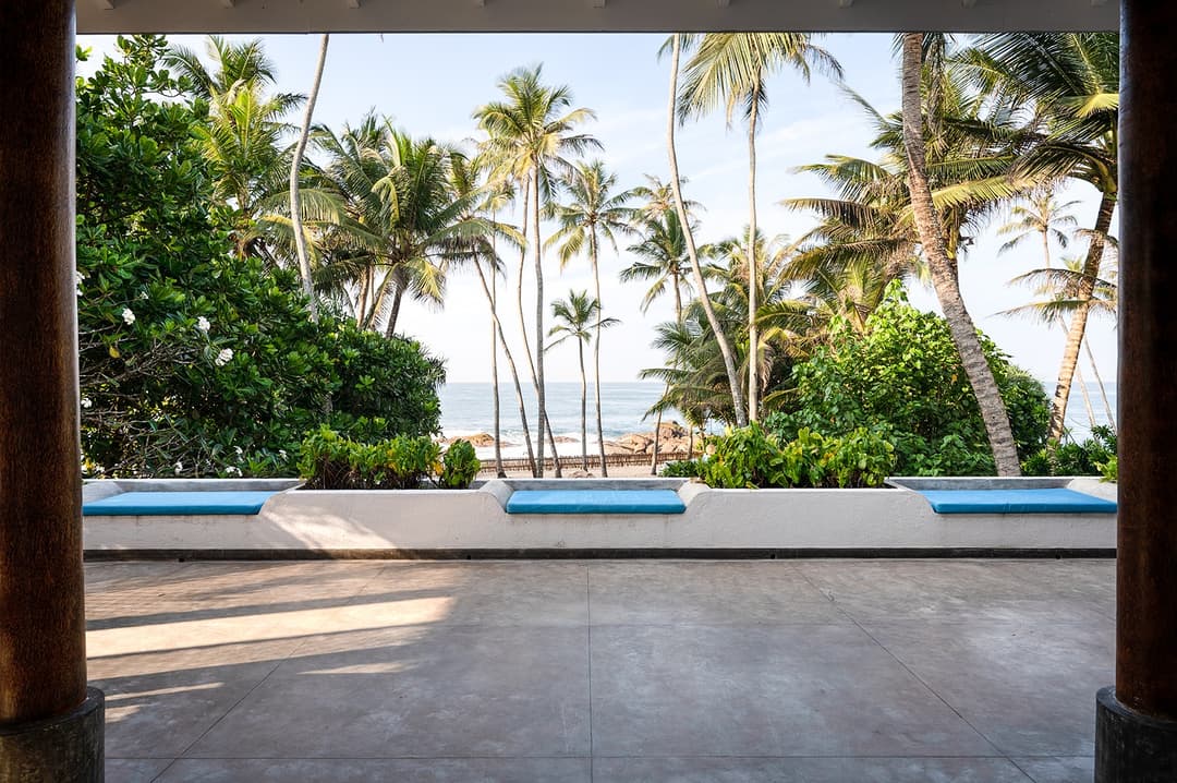 Wide angle view of beachfront villa master suite with four-poster bed Unawatuna