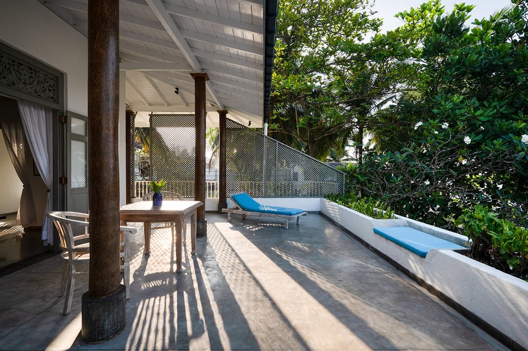 Beachfront villa pool with hanging swing seat and timber pergola Unawatuna