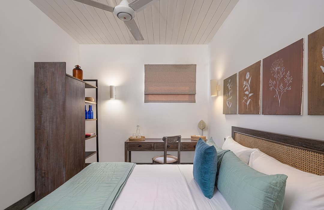 Ahangama beachfront villa bedroom with twin beds and teal accent cushions