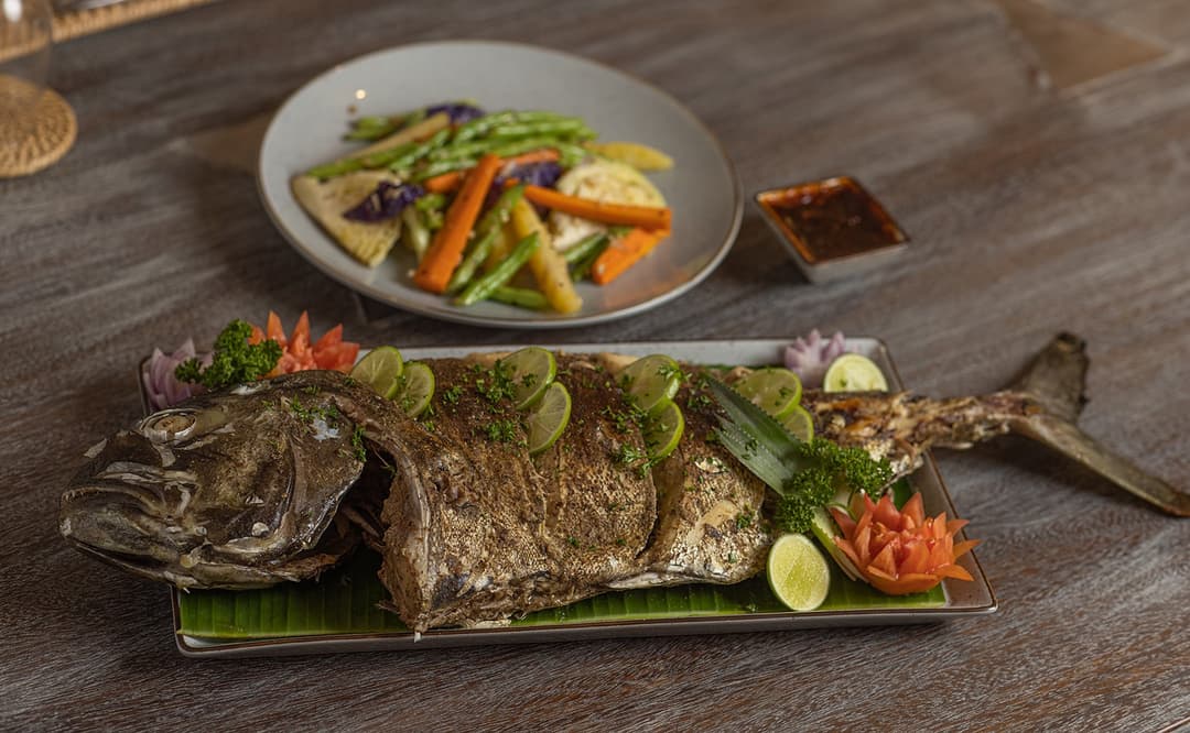 Ahangama beachfront villa chef baked fish wrapped in banana leaf plated