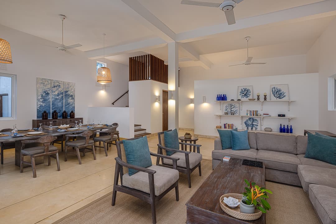 Ahangama beachfront villa living and dining area with pendant lights and blue accents