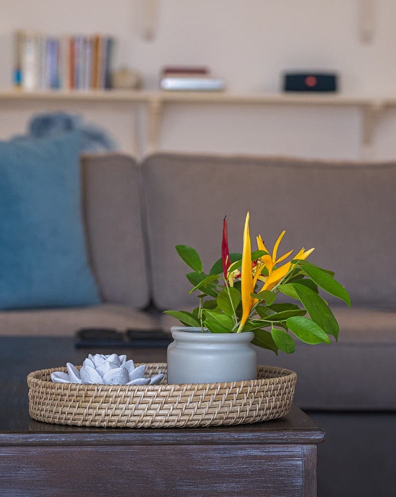 Ahangama beachfront villa living room sofa with teal cushions and flower tray