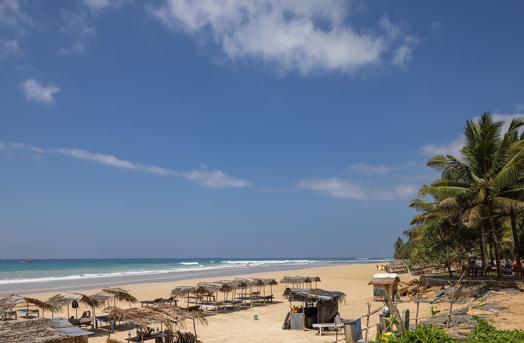 Kabalana Beach Ahangama with sun loungers, umbrellas and vivid blue sky