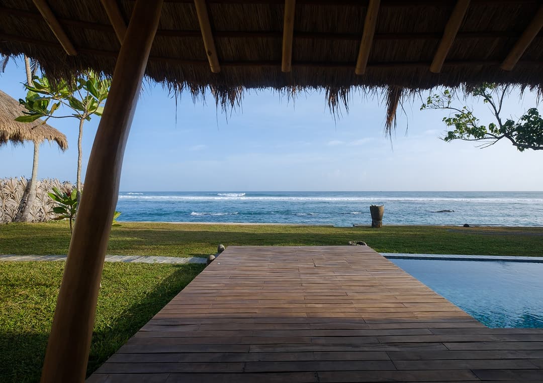 Wide view of Boho House Mirissa pool, deck and Indian Ocean daytime