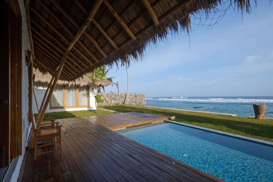 Boho House Mirissa pool on timber deck with Indian Ocean view daytime