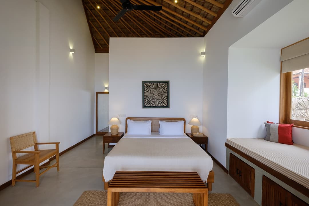 Mirissa villa bedroom king bed with white linen and natural light