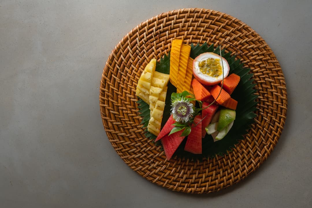 Overhead villa chef plated vegetables on wicker tray Mirissa Sri Lanka