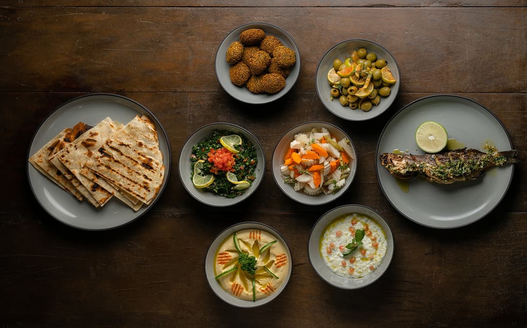 Overhead villa chef seafood and rice bowl spread on dining table Mirissa