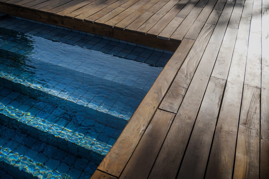 Mirissa villa pool with timber deck close up and blue water