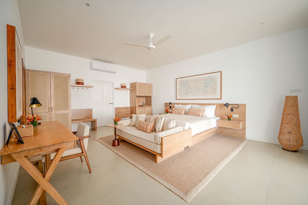 Mirissa luxury villa bedroom with king bed, cream linen and timber desk
