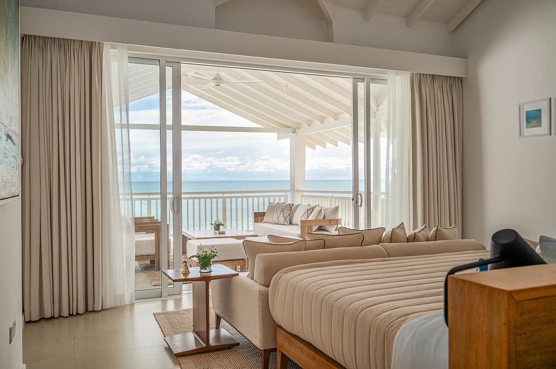 Mirissa luxury villa bedroom with king bed and ocean view linen curtains