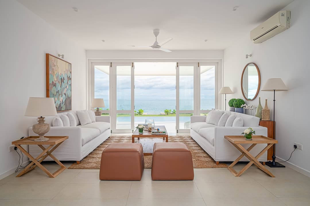Mirissa luxury villa bedroom with king bed, ocean view and terracotta seat