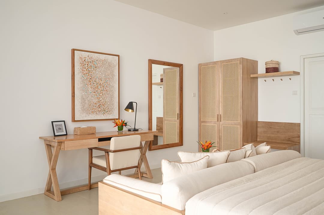 Mirissa luxury villa bedroom with sofa, timber wardrobe and natural light