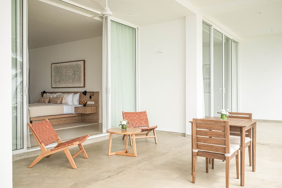 Mirissa luxury villa bedroom study area with timber desk and green window